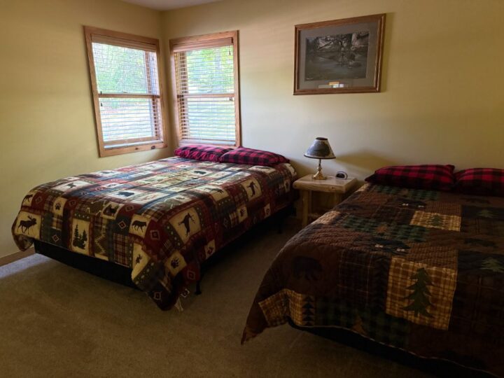 Cozy bedroom with two twin beds and rustic decor