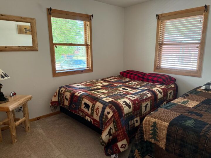 Cozy bedroom with two twin beds and quilts