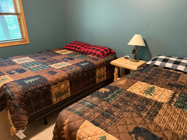 Cozy bedroom with two twin beds and quilts