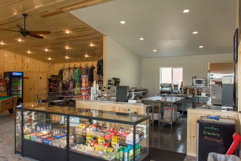 Interior of bait and tackle shop with display cases