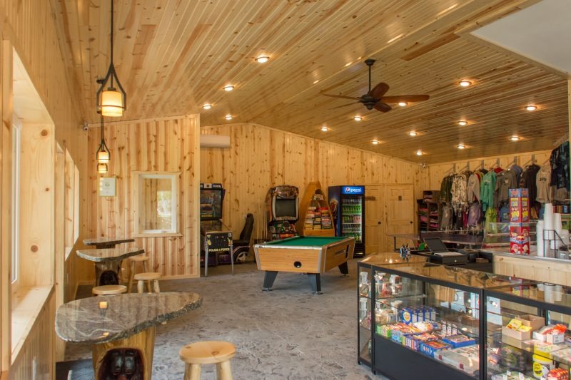 Rustic wooden game room with pool table