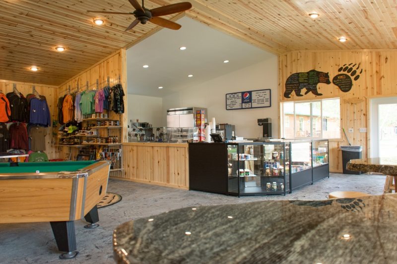Rustic lodge interior with shop and pool table