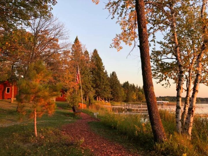 Lakeside cabins and dock at sunset